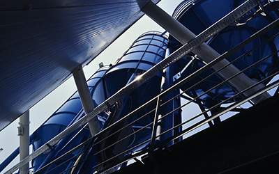 Blue tanks from a ground view looking up